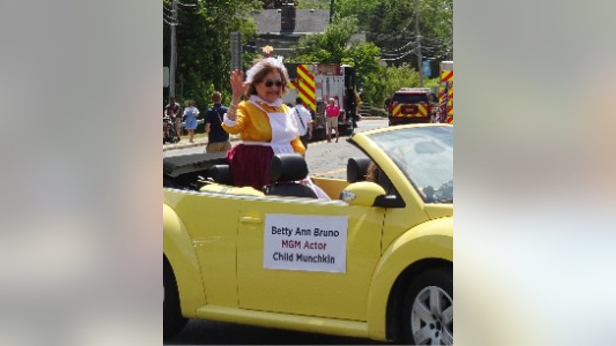 Betty Ann Bruno in a car in a parade