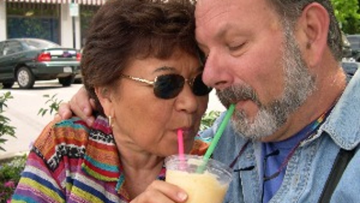 betty ann with husband sharing a drink