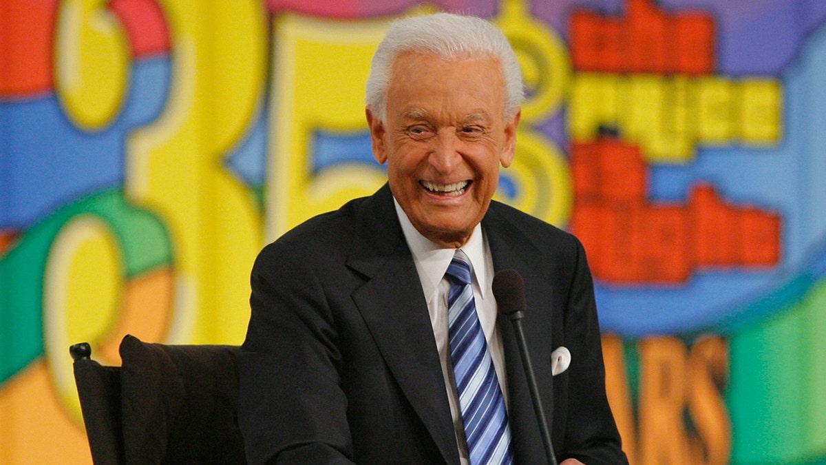 Bob Barker sits on Price is Right set