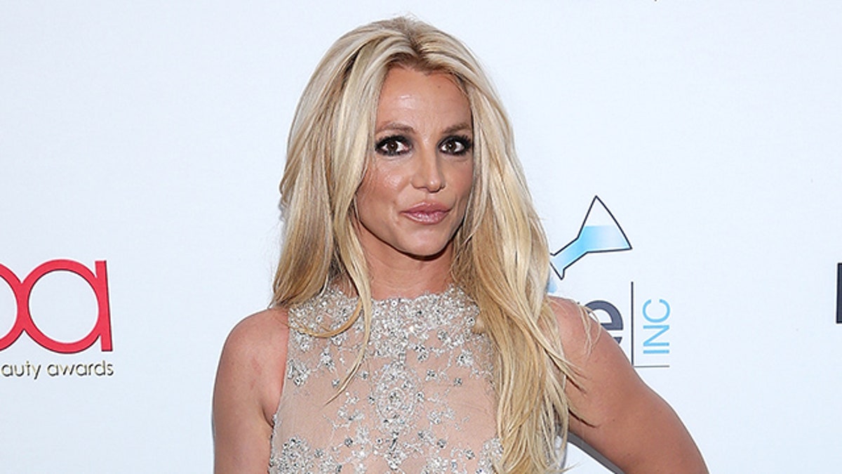 Britney Spears gets licked by mystery man, goes topless in new videos shared days after announcing divorce Fox News pic