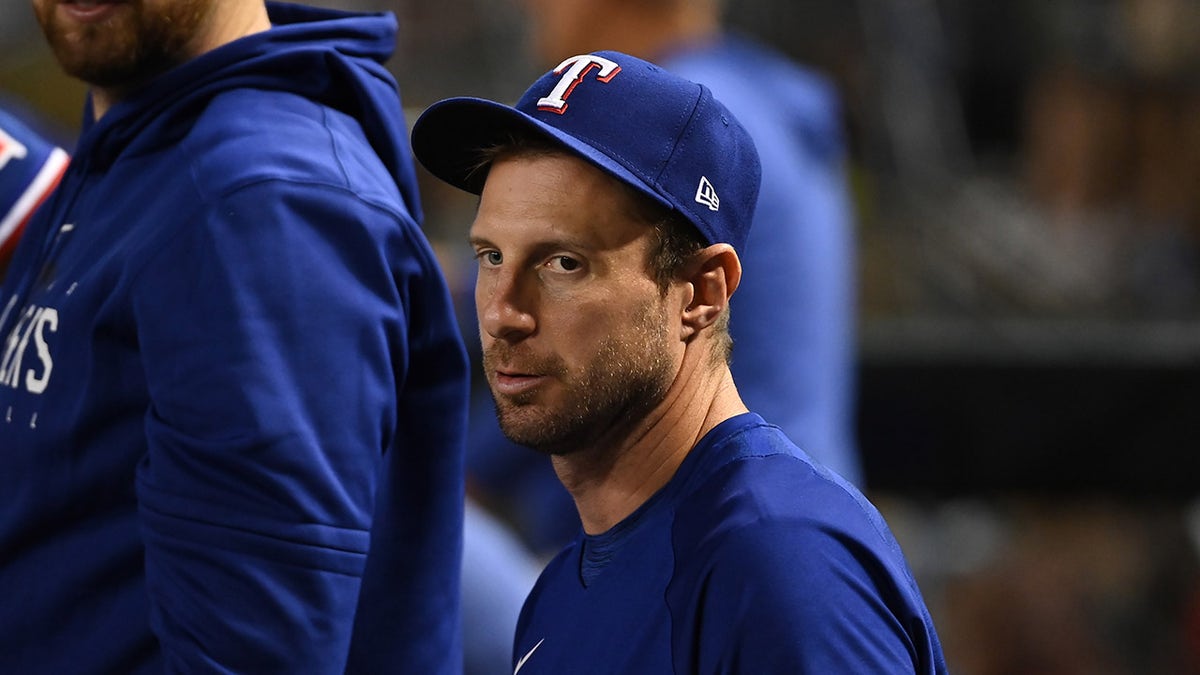 Max Scherzer looks on from the dugout