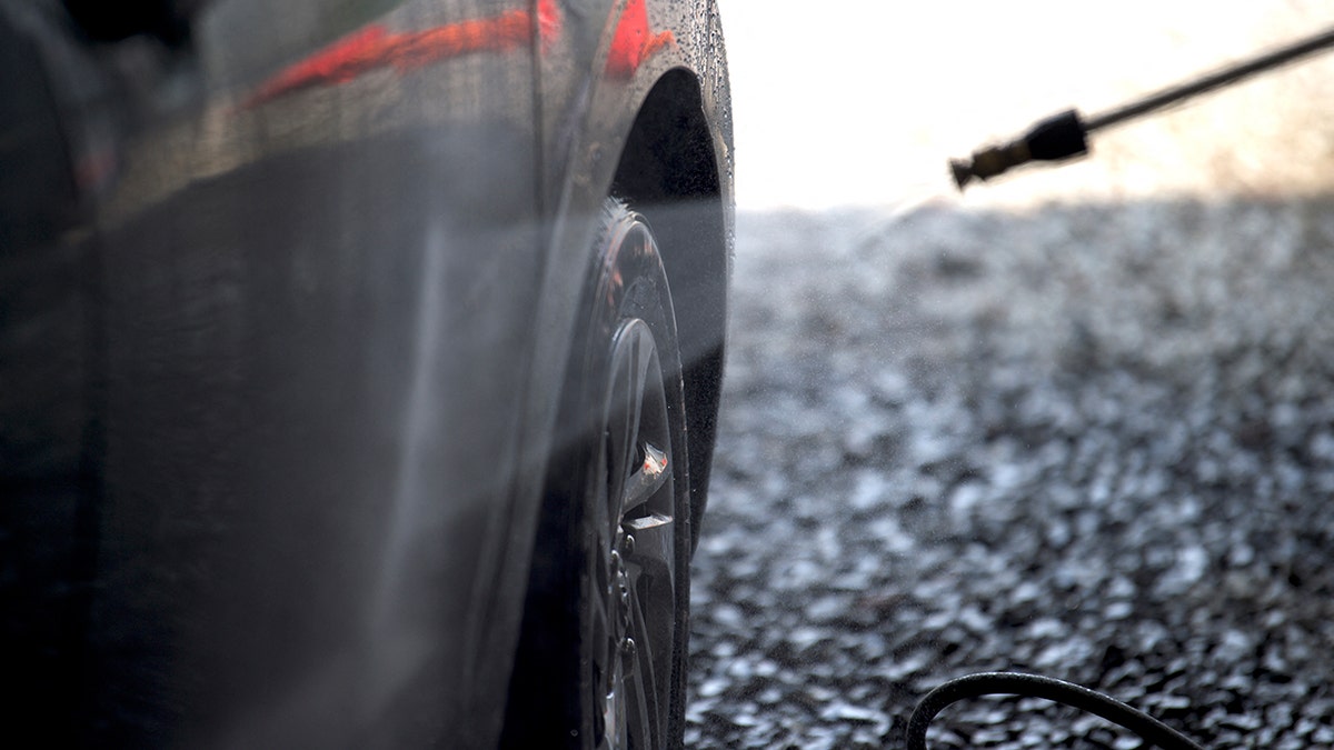 A car being sprayed down