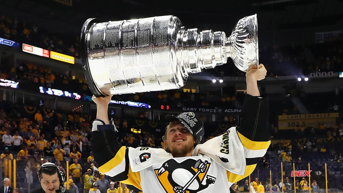 Carl Hagelin holds up the Stanley Cup