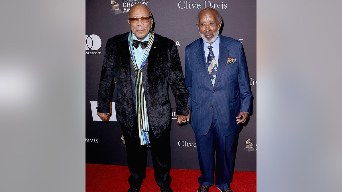 Quincy Jones and Clarence Avant hold hands at Clive Davis' 2019 Pre-GRAMMY Gala 