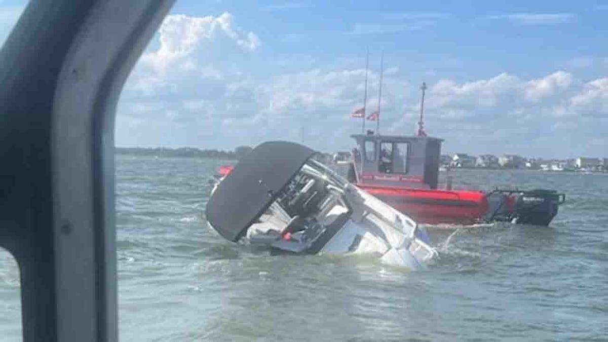 coast guard helping sinking vessel