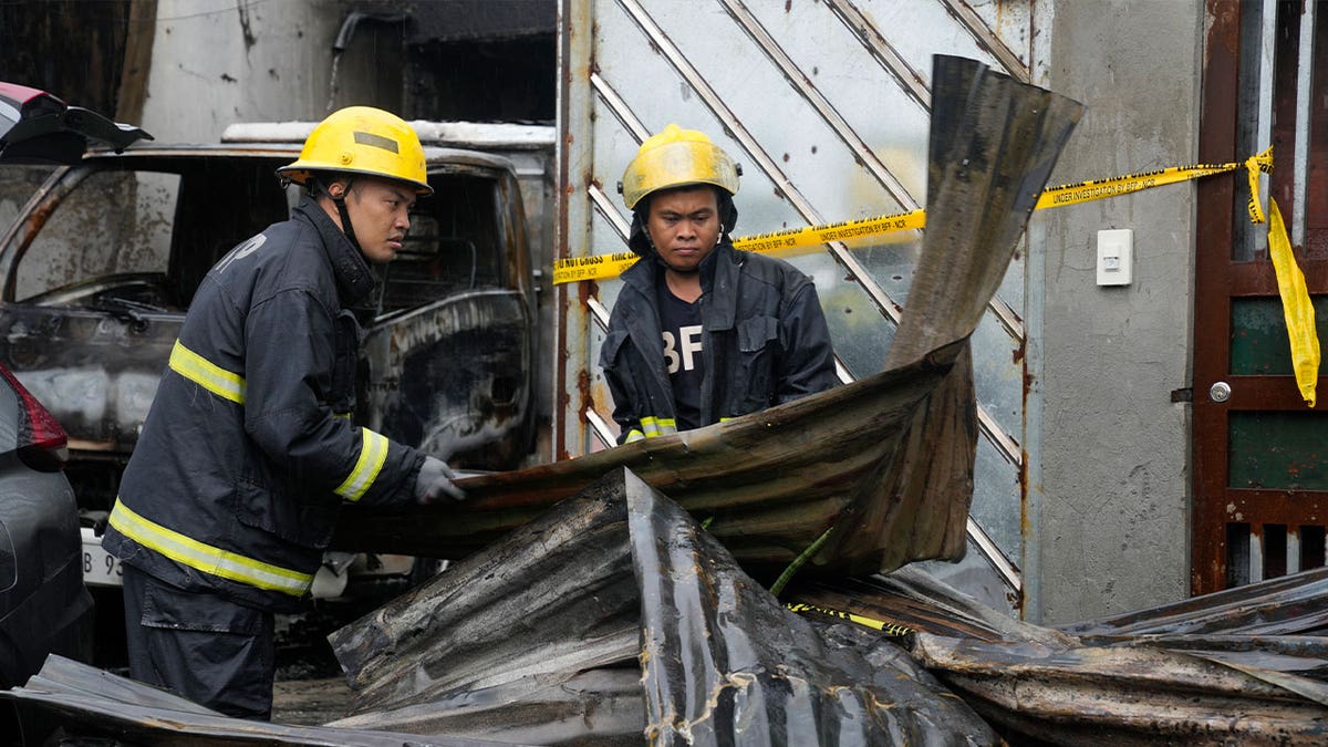 firefighters at scorched factory