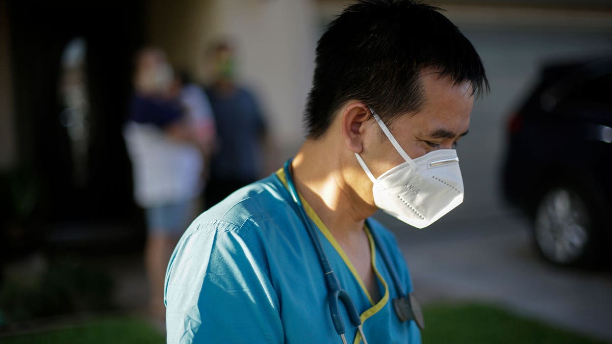 Dr. Tien Vo leaves after talking with a family quarantining during the pandemic on July 23, 2020, in Calexico, California. 