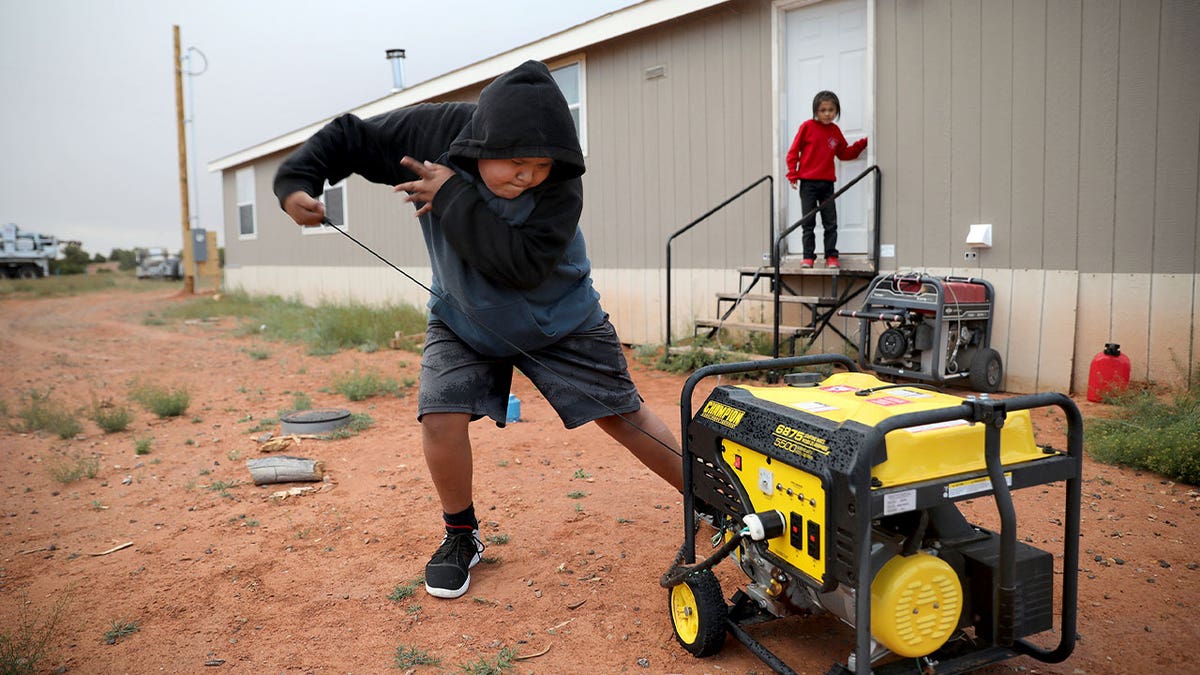 boy starts generator