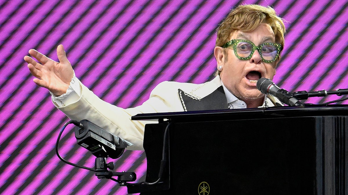 Elton John playing piano