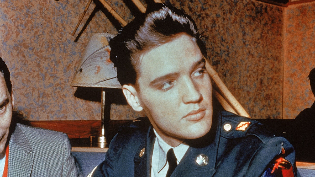 Elvis Presley wears US Army uniform