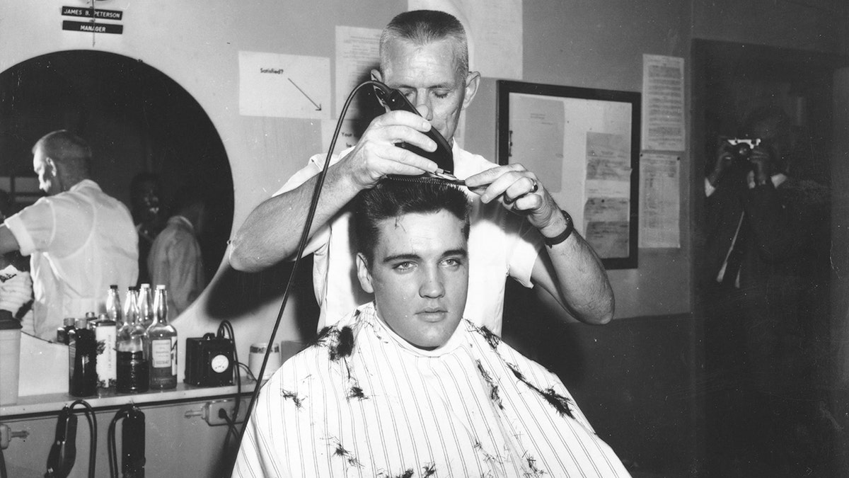 Elvis Presley gets his hair cut in the Army