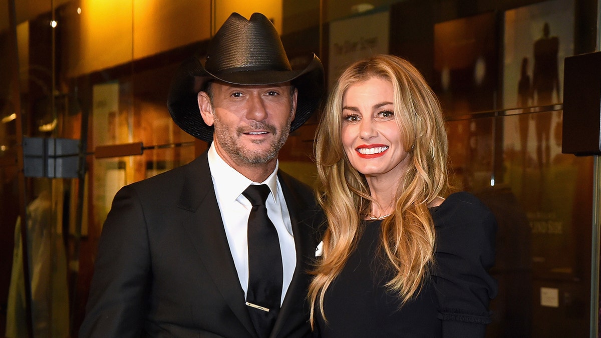 Faith Hill wears black dress to match husband Tim McGraw's black suit and cowboy hat