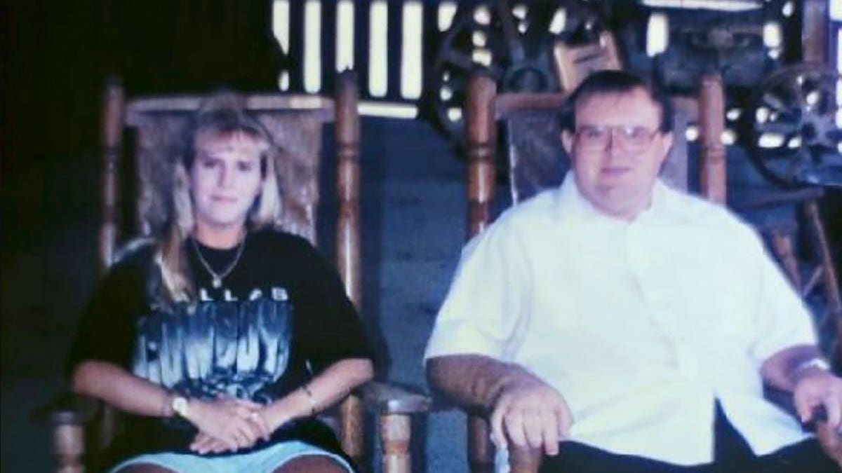 Charles Givens poses next to sister