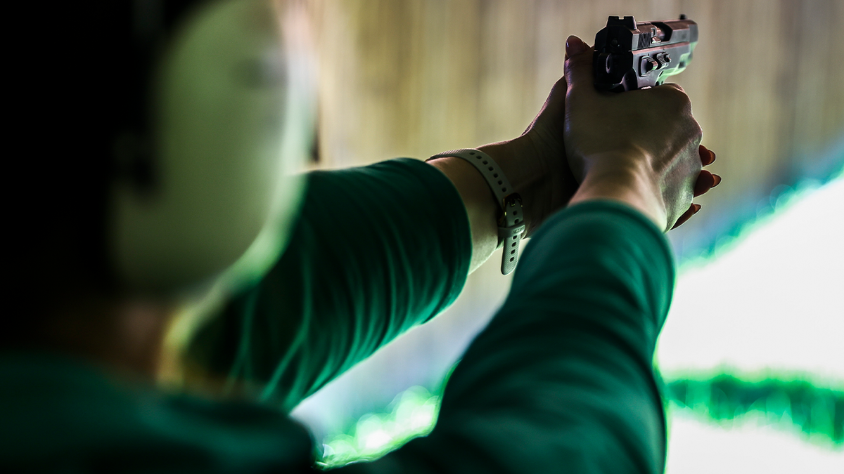 Woman shooting gun