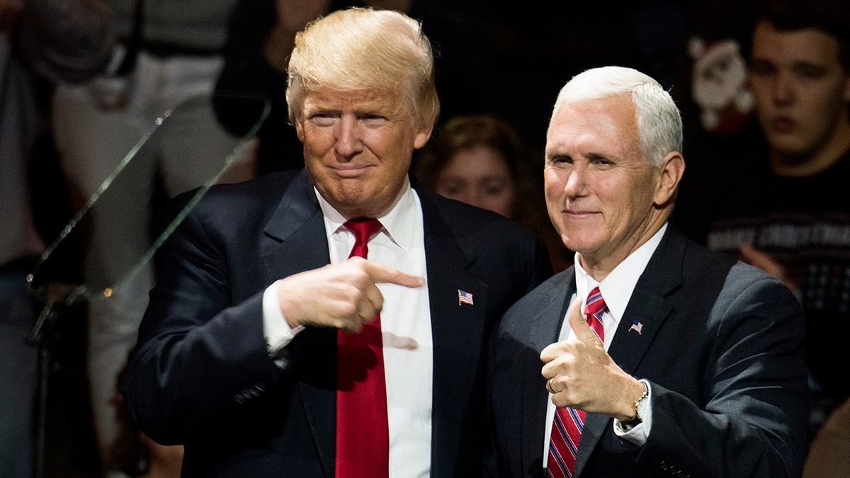 President-elect Donald Trump and Vice President-elect Mike Pence stand onstage