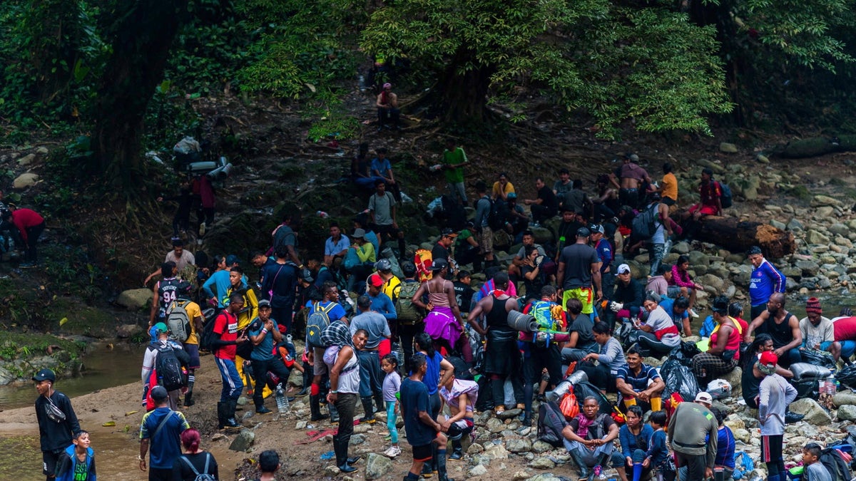 Migrants cross through Darien Gap