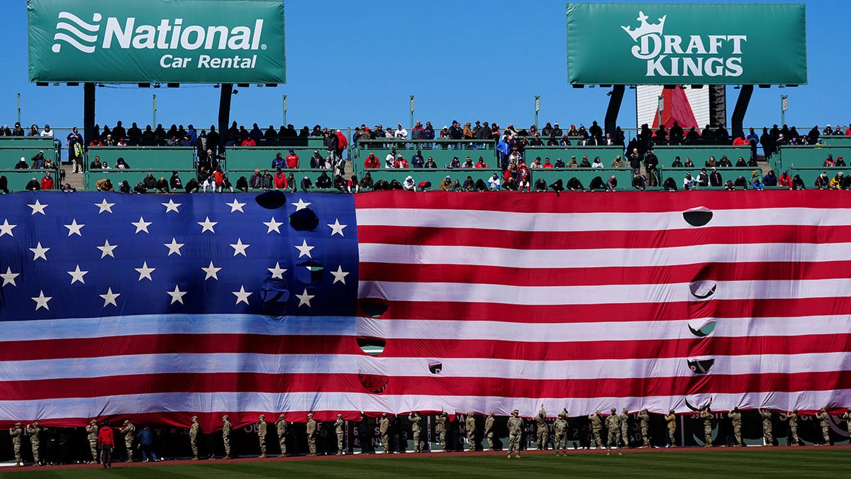 Boston Red Sox fan scales back of Green Monster, enters Fenway Park during  game vs. Yankees; now in police custody 