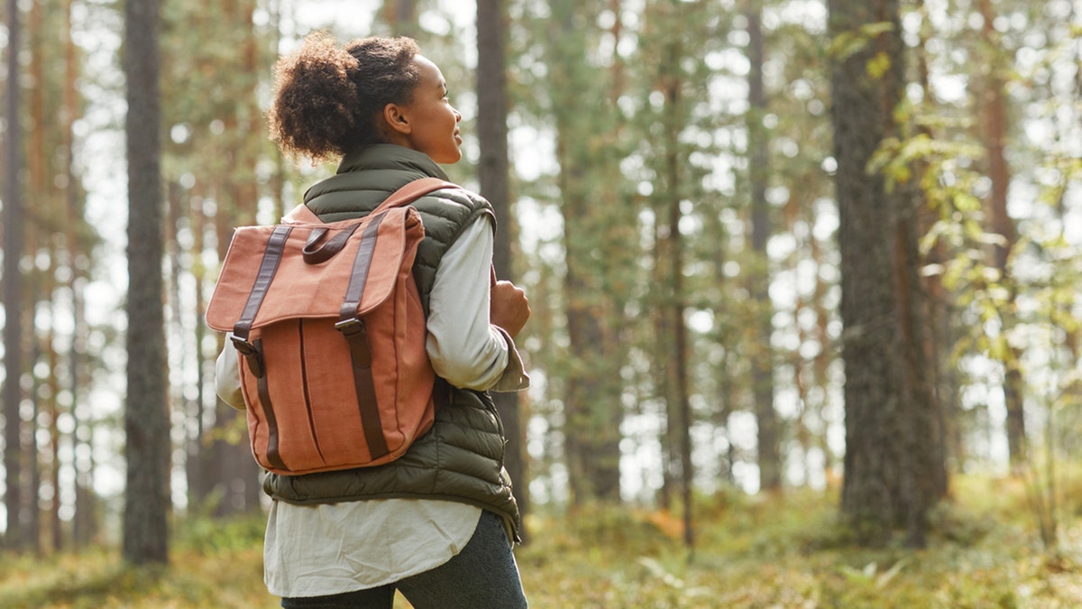 young female hiking pinch backpack