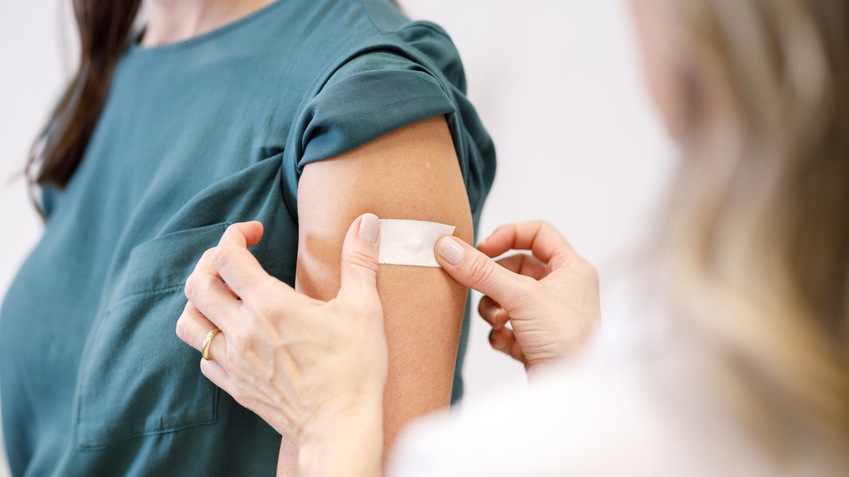 Woman getting vaccine