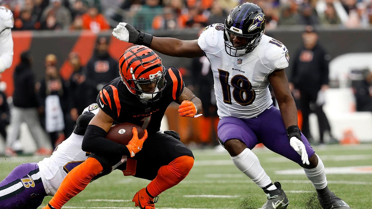 Ja'Marr chase gets tackled in an NFL game