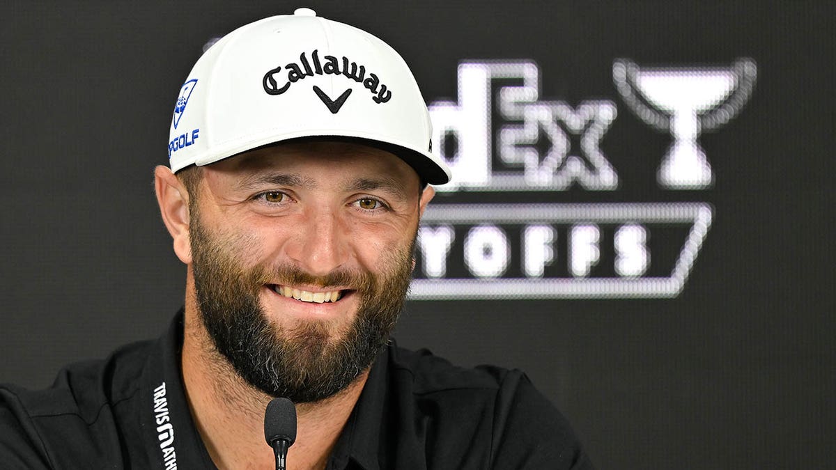 Jon Rahm talks to the media