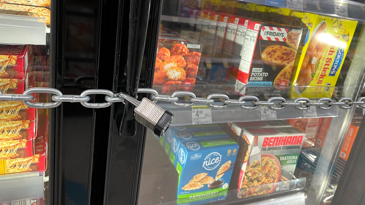 SAN FRANCISCO, CALIFORNIA - JULY 18: A chain with padlocks secures freezer doors at a Walgreens store on July 18, 2023 in San Francisco, California. A San Francisco Walgreens store has locked its freezers with chains and padlocks to thwart shoplifters that have been hitting the store on a regular basis and stealing frozen pizzas and ice cream. 