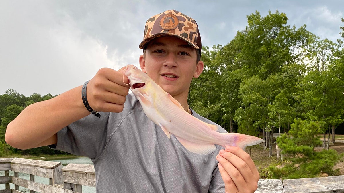 logan with albino catfish