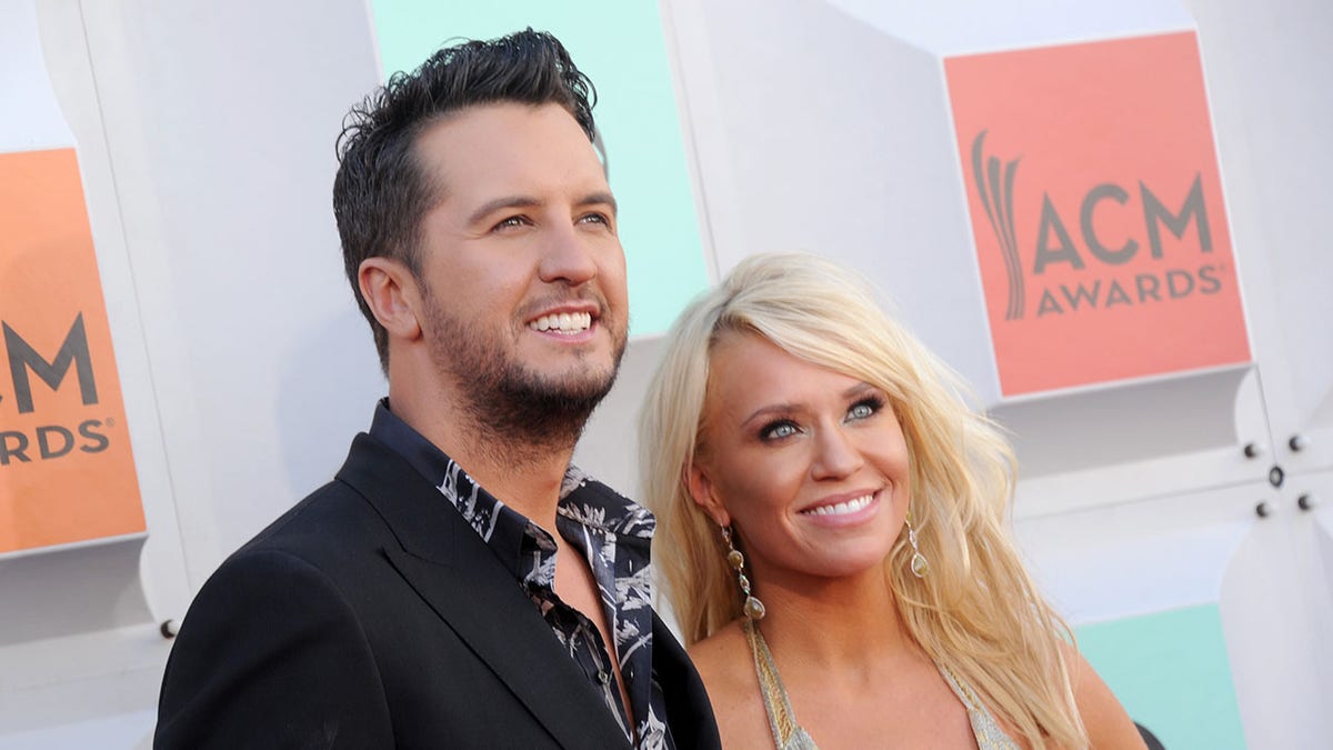 Luke Bryan poses for a photo with wife Caroline Boyer