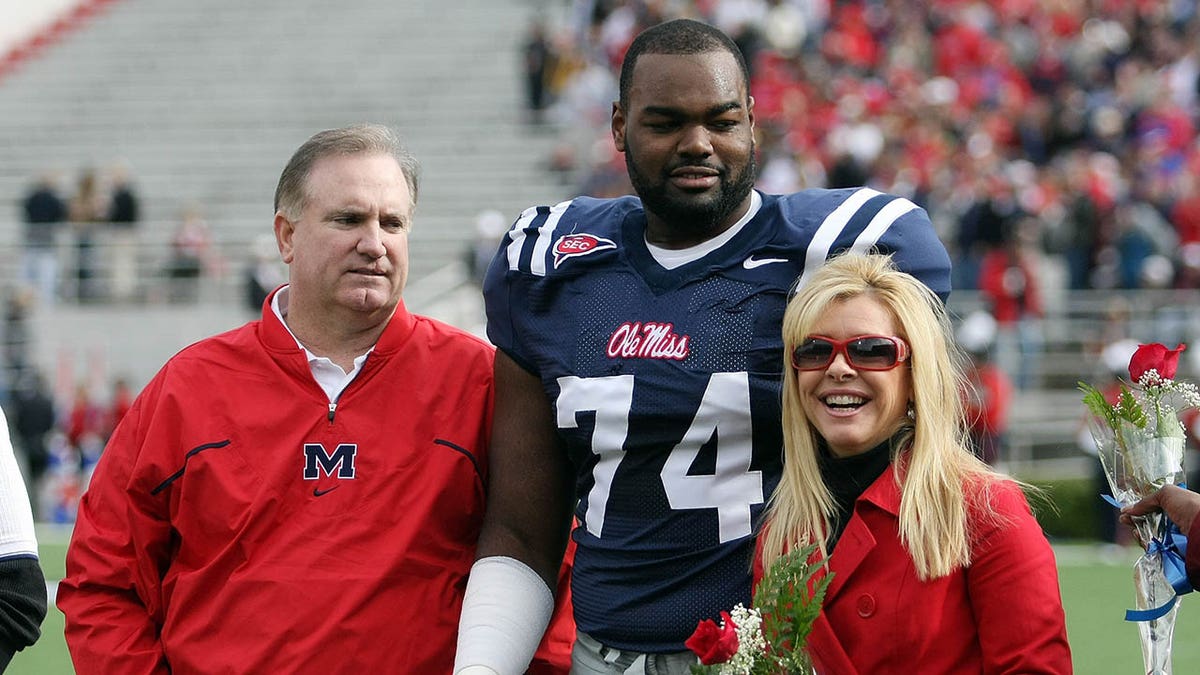 Michael Oher stands with his family ahead of an Ole miss game