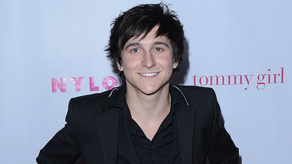 Mitchel Musso wears all black on red carpet