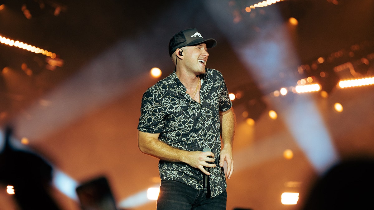 Morgan Wallen wears baseball hat over shaved head