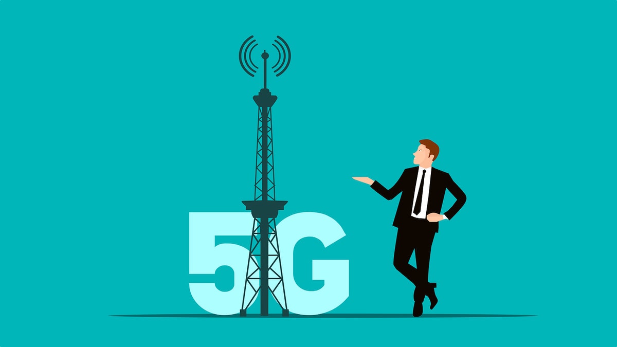 Graphic of a man standing next to a 5G tower.