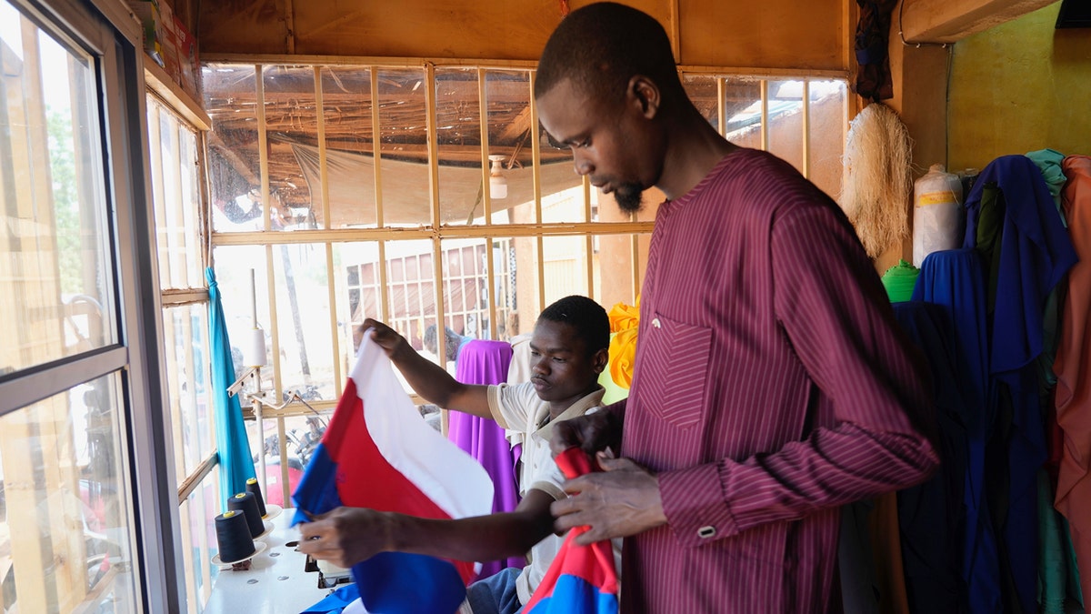 Nigerien seamsters make Russian flags
