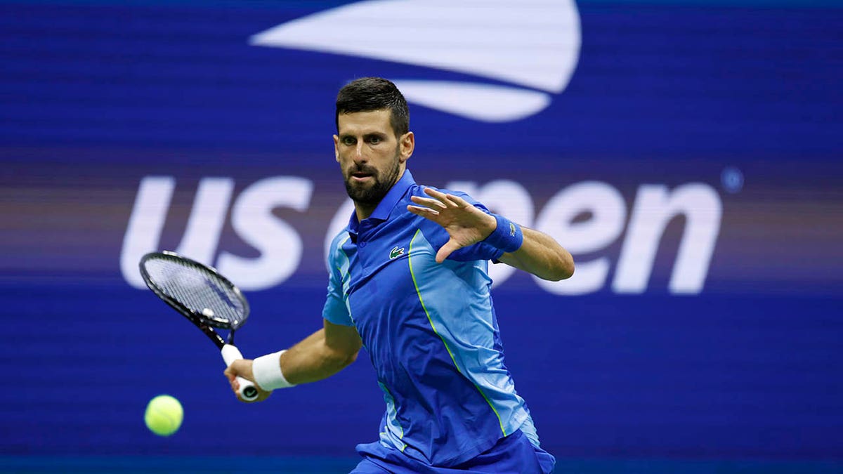 Novak Djokovic returns a ball