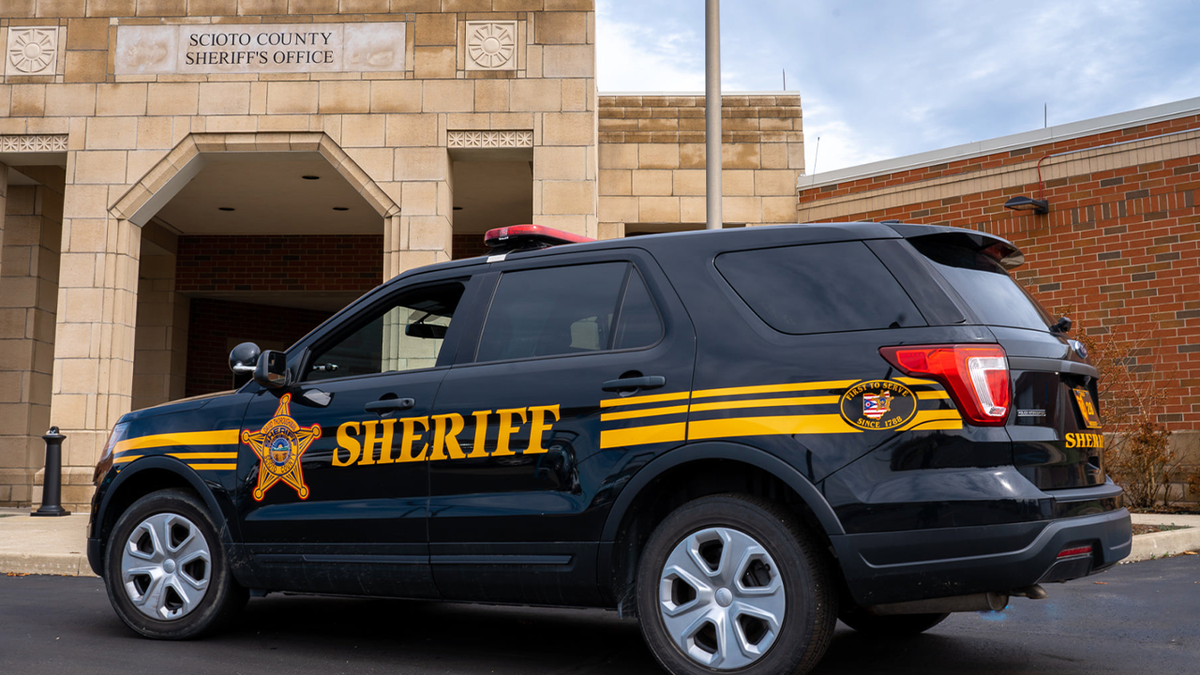 Sheriff 's SUV outside sheriff's office building