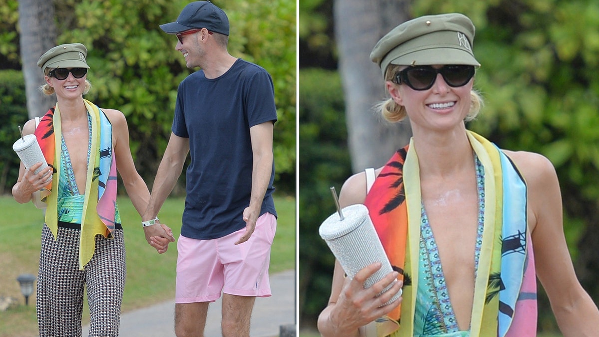 Paris Hilton and Carter Reum hold hands on a walk in Maui