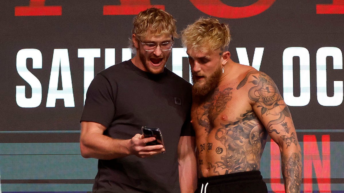 Jake and Logan Paul at weigh in