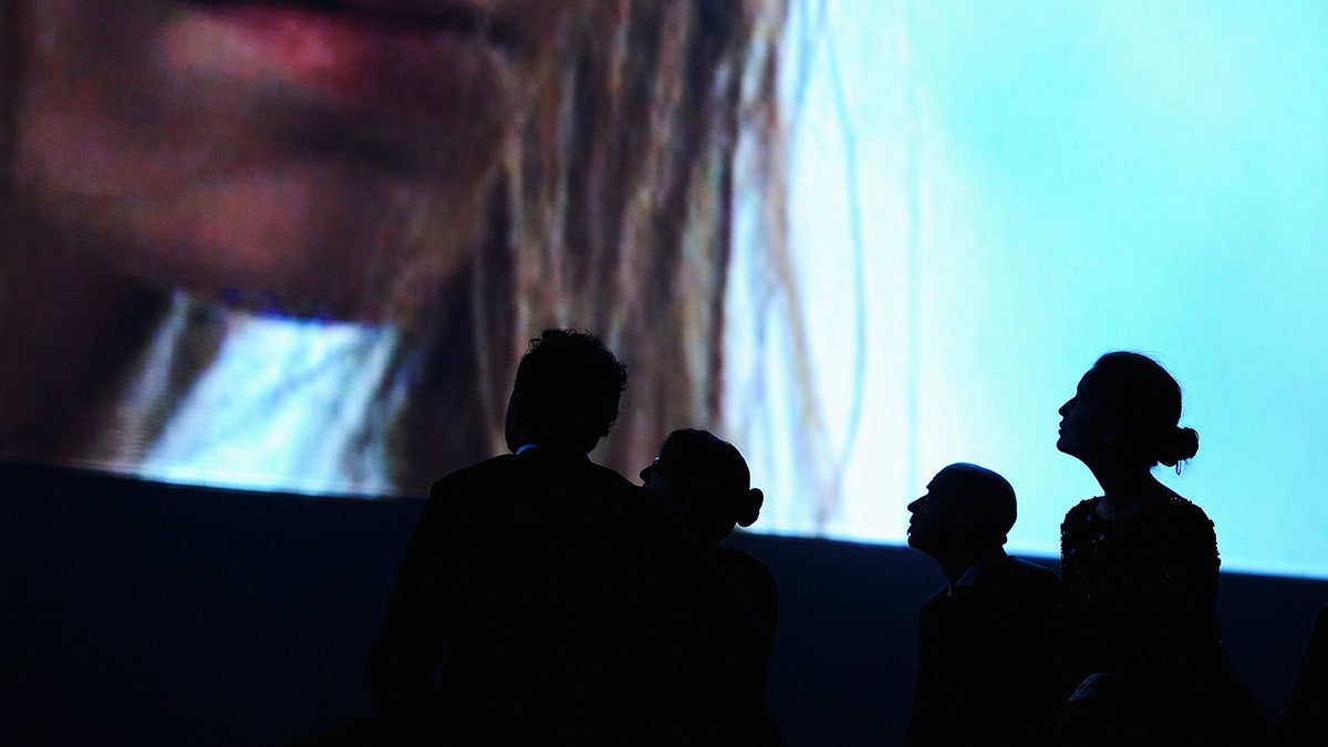 People watching a movie at the Venice Film Festival