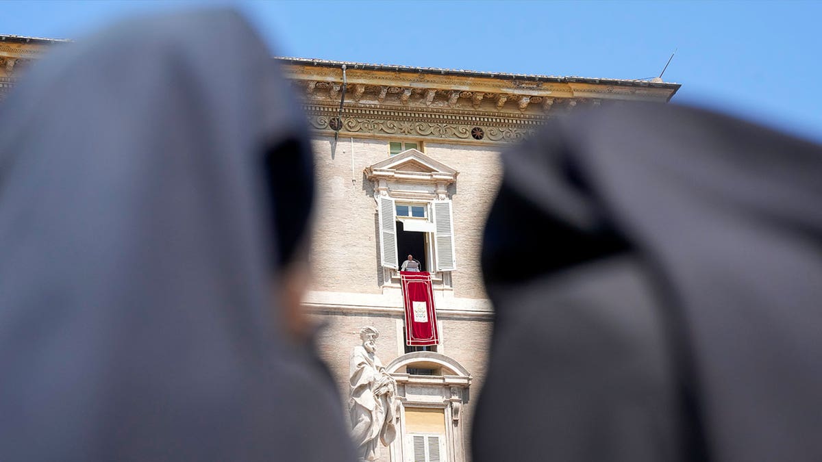 nuns look at Pope Francis