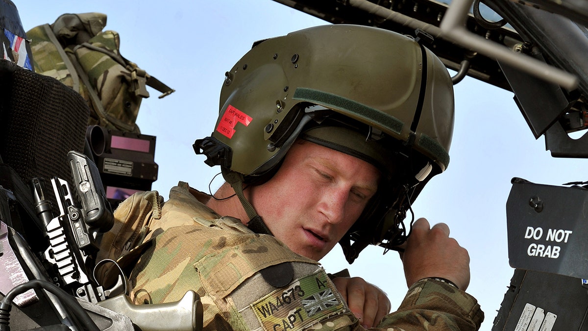 Prince Harry in a Apache helicopter