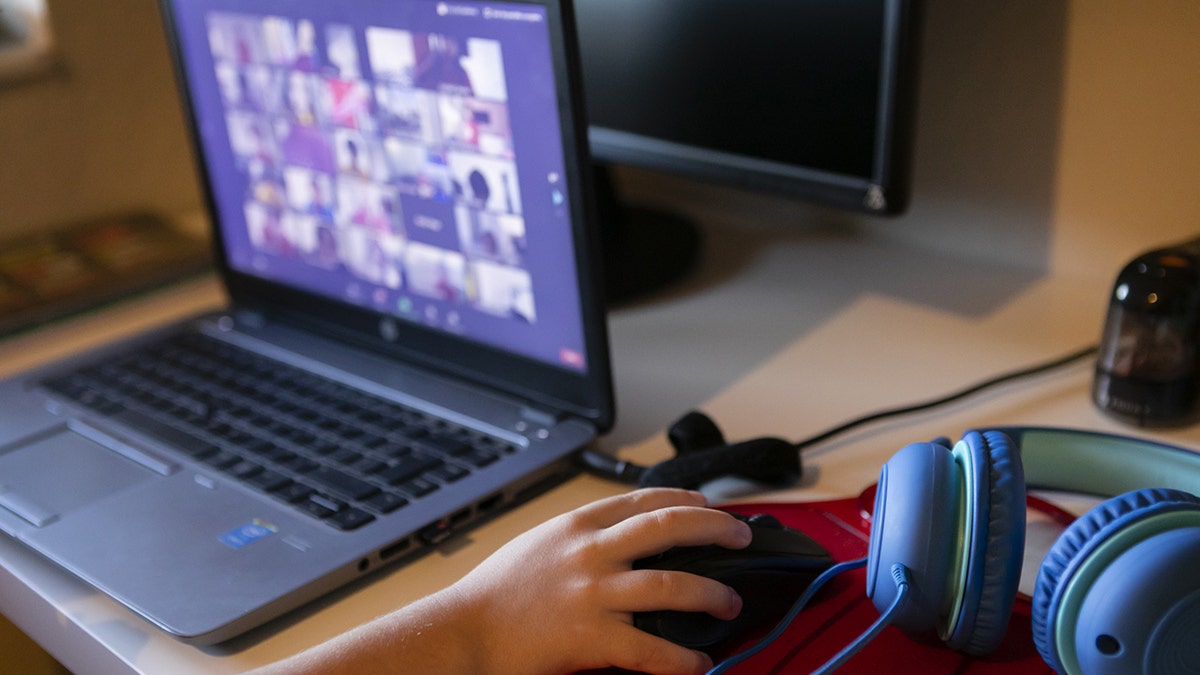 A student attends an online class from home in Miami, Florida, U.S., on Thursday, Sept. 3, 2020. Photographer: Eva Marie Uzcategui/Bloomberg via Getty Images
