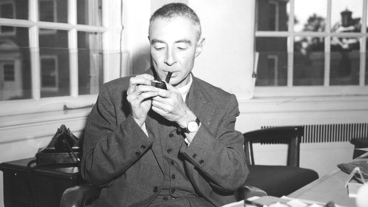 J. Robert Oppenheimer at his desk 