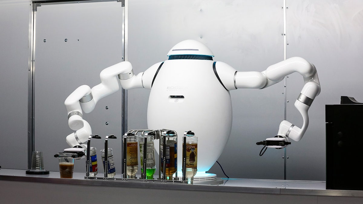 Robot bartender makes a cocktail