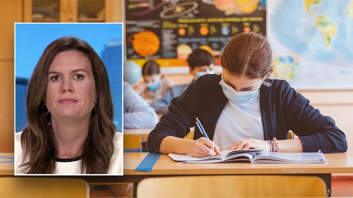 Sarah Huckabee Sanders over a student writing