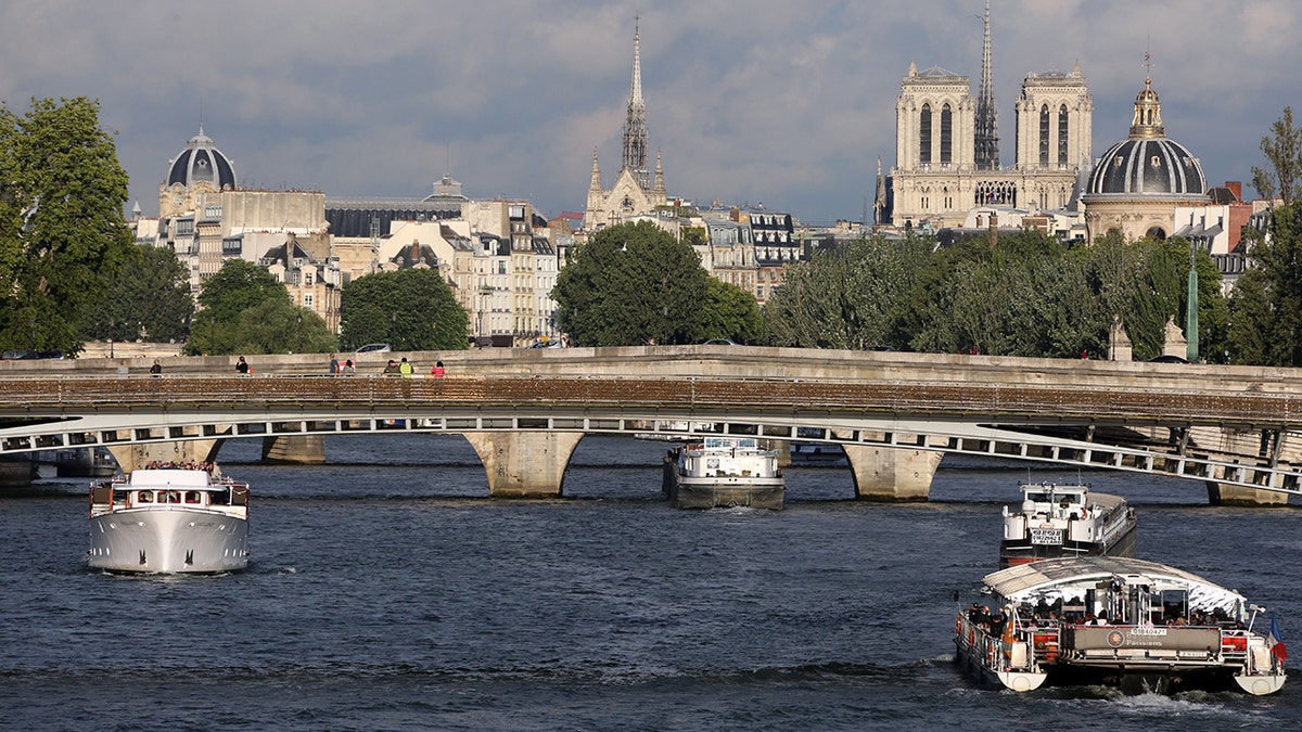 A boat sailing in the Seine River