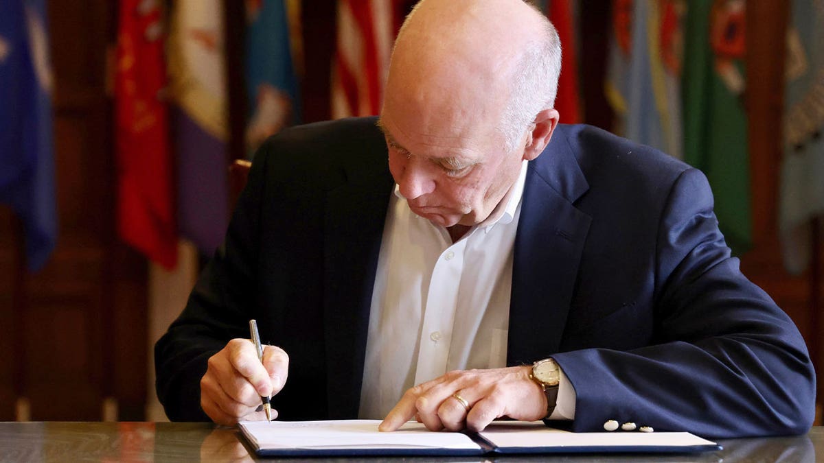 Republican Gov. Greg Gianforte signs a law