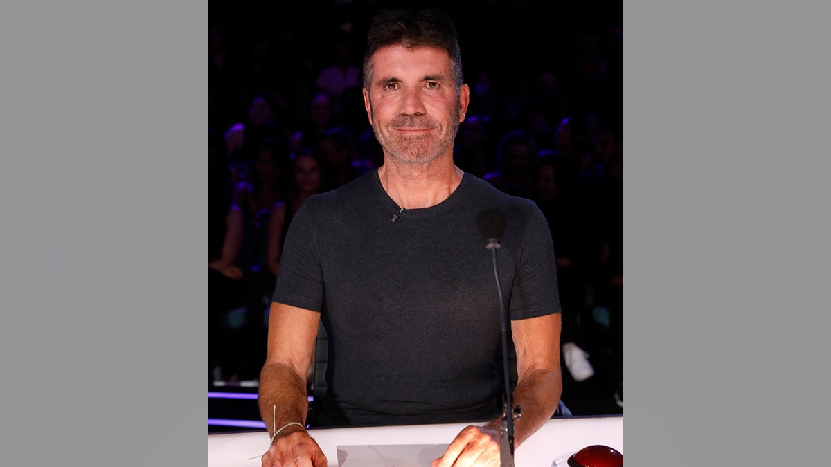 Simon Cowell behind the judges desk on "Amercia's Got Talent"