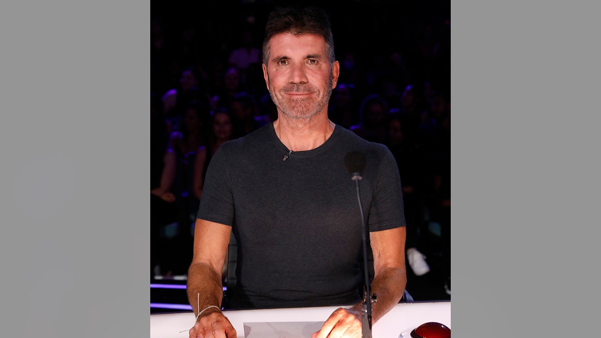 Simon Cowell behind the judges desk on "America's Got Talent"