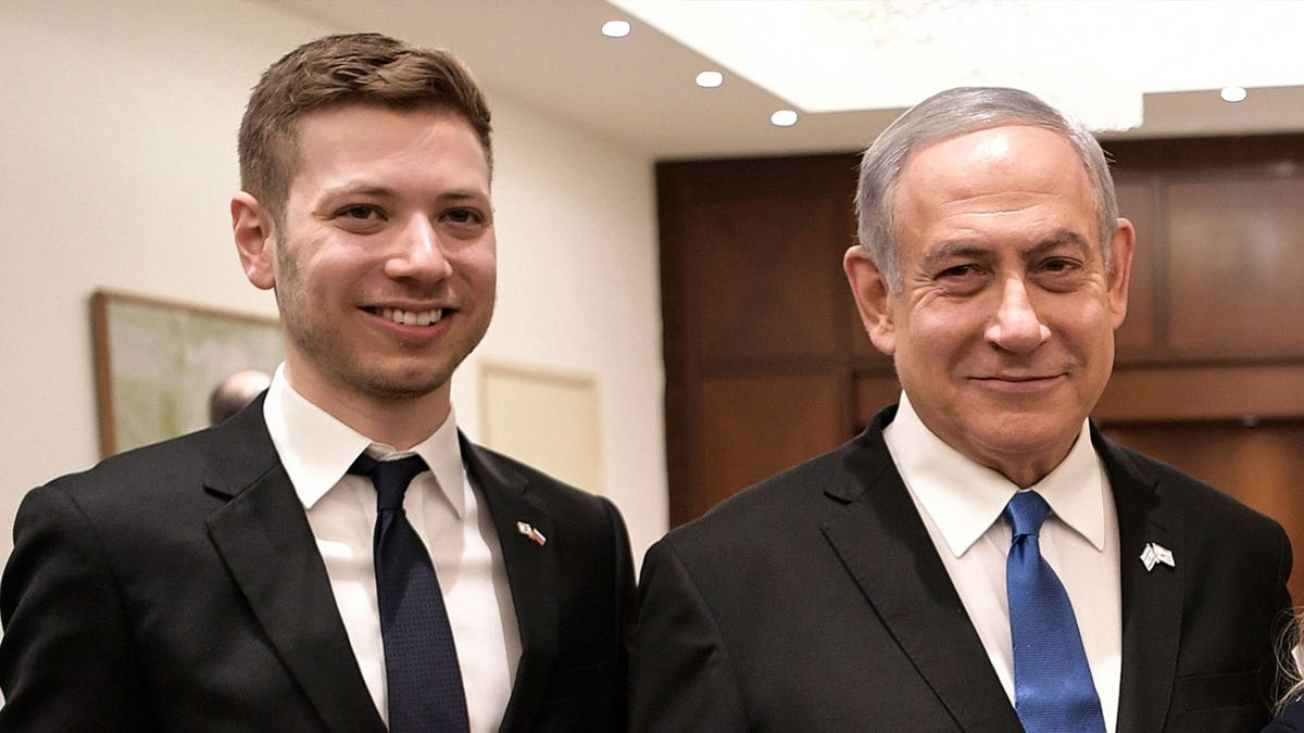 Israeli Prime Minister Benjamin Netanyahu, right, and son Yair