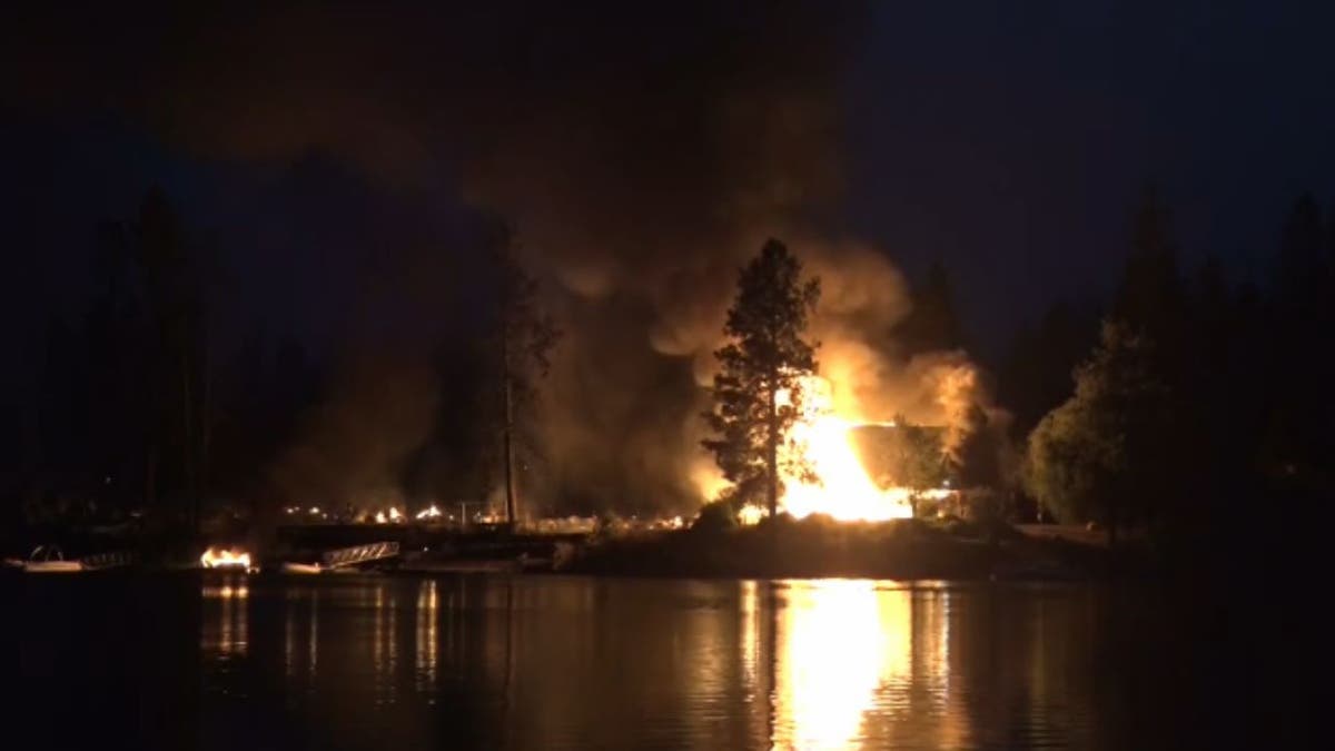 Gray Fire burning near lake
